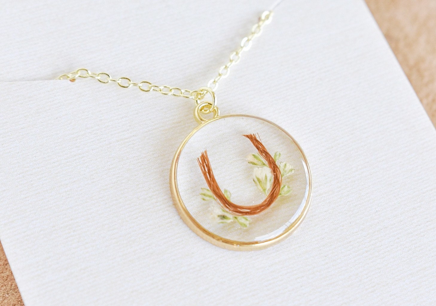 custom handmade horse hair keepsake necklace, made with resin and horse mane or tail hair preservation