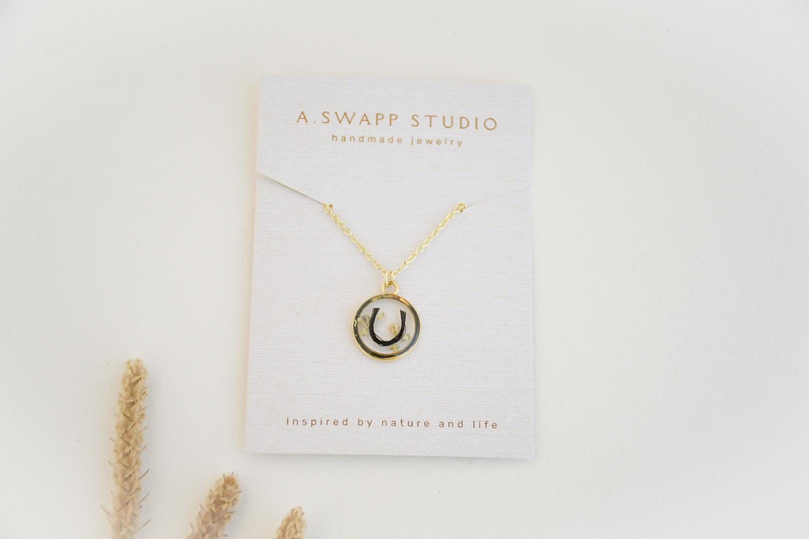 custom handmade horse hair keepsake necklace, made with resin and horse mane or tail hair preservation