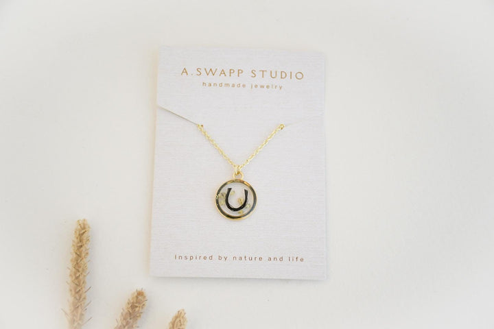 custom handmade horse hair keepsake necklace, made with resin and horse mane or tail hair preservation