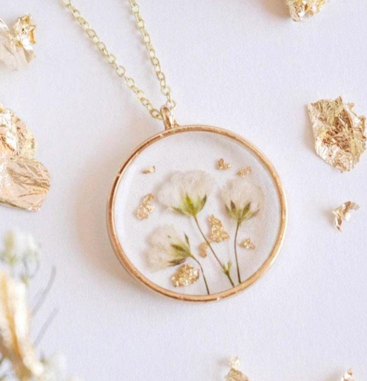 Gold resin necklace with babys breath flowers and gold leaf. Flowers are from a wedding bouquet, funeral, anniversary, graduation. Flower jewelry gift.