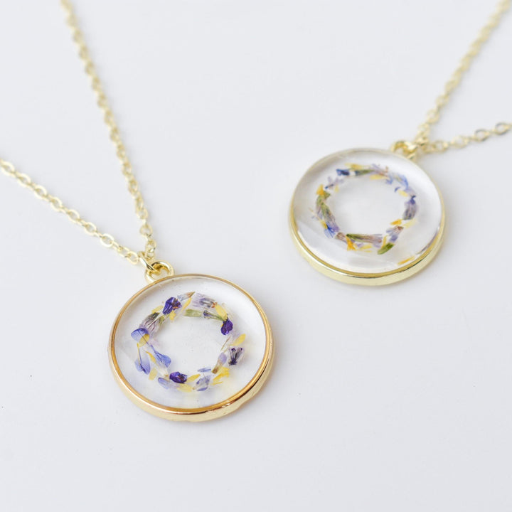 A custom gold resin necklace with flowers. Flowers are from a wedding bouquet, funeral, anniversary, graduation. Handmade pressed flower preservation jewelry gift.