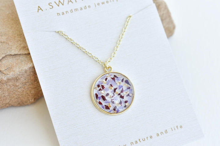 A custom gold resin necklace with flowers. Flowers are from a wedding bouquet, funeral, anniversary, graduation. Handmade pressed flower preservation jewelry gift.