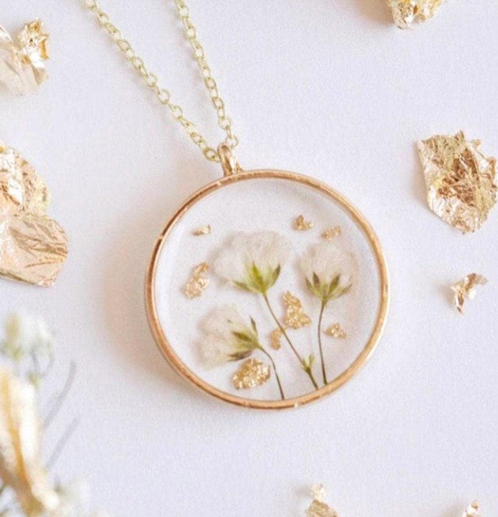 Gold resin necklace with babys breath flowers and gold leaf. Flowers are from a wedding bouquet, funeral, anniversary, graduation. Flower jewelry gift.